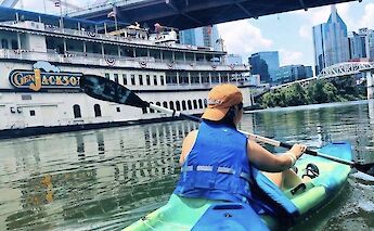 Kayaking past a boat, Nashville, Tennessee, USA. CC:Music City Adventure Co