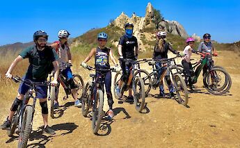 Group photo in front of a rocky outcrop, Malibu, California, USA. CC:LifeRush Adventures