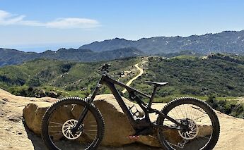 Mountain bike parked by a rock on the Backbone Trail, Malibu, California, USA. CC:LifeRush Adventures