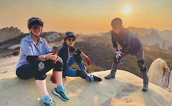Sitting on a rock at sunset, Malibu, California, USA. CC:LifeRush Adventures