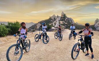 Standing with the bikes at sunset, Malibu, California, USA. CC:LifeRush Adventures