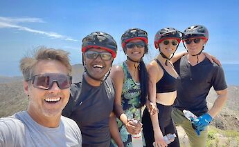 Tour guide posing with a group, Malibu, California, USA. CC:LifeRush Adventures