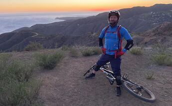 Resting on top of the ridge at sunset, Malibu, California, USA. CC:LifeRush Adventures