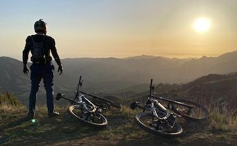 Standing on top of the ridge at sunset, Malibu, California, USA. CC:LifeRush Adventures