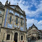 Blue and white tiled building in Porto, Portugal bike tours. Maksim@Unsplash