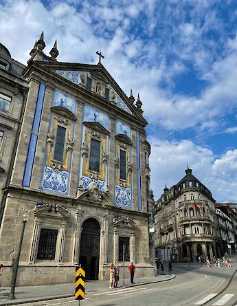 Blue and white tiled building in Porto, Portugal bike tours. Maksim@Unsplash