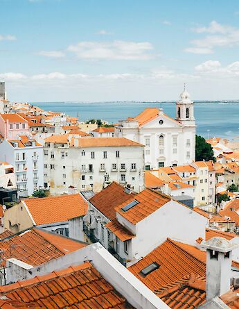 Terracotta roofs in Lisbon, Portugal bike tours. Tom Byrom@Unsplash