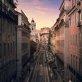 Sunset on the streets of Lisbon, Portugal bike tours. Urban Vintage@Unsplash
