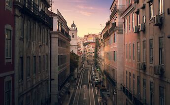 Sunset on the streets of Lisbon, Portugal bike tours. Urban Vintage@Unsplash