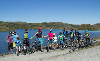 Bike tour group by a fjord, Voss, Norway. CC:Outdoor Norway