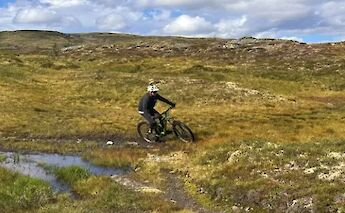 Biking past water, Voss, Norway. CC:Outdoor Norway