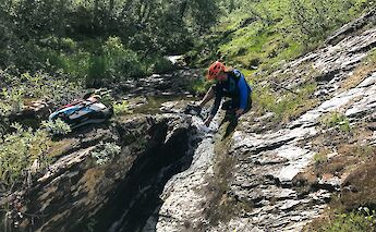 Filling a bottle with fjord water, Voss, Norway. CC:Outdoor Norway