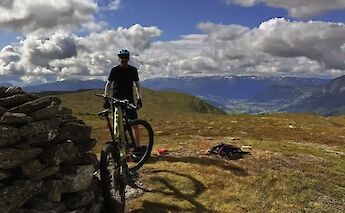 Standing with a bike on top of a mountain, Voss, Norway. CC:Outdoor Norway