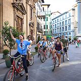 Bike tour guide leading the group through Florence, Italy. CC:TO