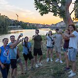 Enjoying wine on the banks of the river, Florence, Italy. CC:TO