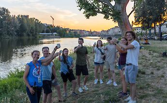 Enjoying wine on the banks of the river, Florence, Italy. CC:TO