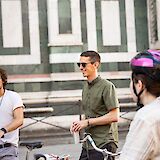 Listening to the tour guide on a Florence bike tour, Italy. CC:TO