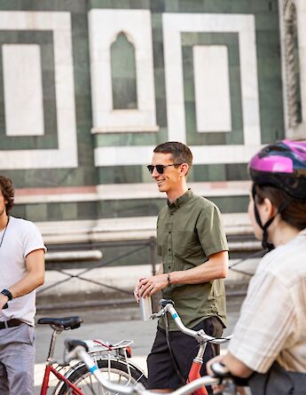 Listening to the tour guide on a Florence bike tour, Italy. CC:TO