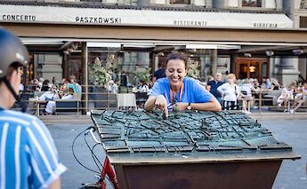 Tour guide explaining the 3D map in Florence, Italy. CC:TO