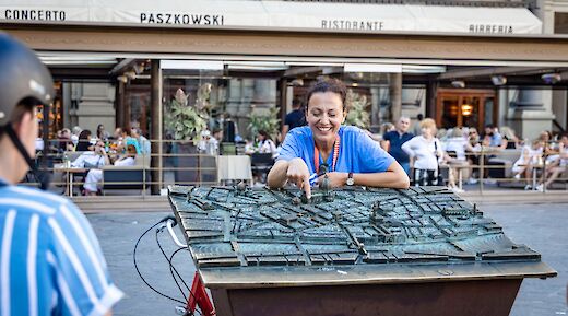 Tour guide explaining the 3D map in Florence, Italy. CC:TO