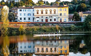 Watching rowing boats on the river in Florence, Italy. CC:TO
