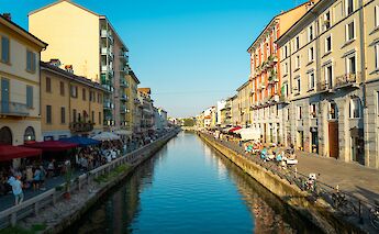 Seating along the Navigli canal, Milan, Italy. Mathieu Gauzy@Unsplash