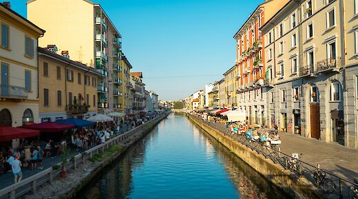 Seating along the Navigli canal, Milan, Italy. Mathieu Gauzy@Unsplash