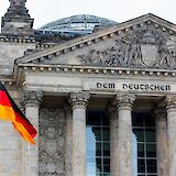 German flag outside the Reichstag, Berlin, Germany. Rasmus Gundorff Saed@Unsplash