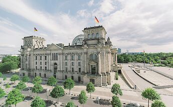 Trees outside the Reichstag, Berlin, Germany. Fionn Grosse@Unsplash