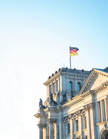 German flag on the Reichstag, Berlin. Bram@Unsplash