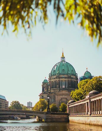 Museum Island viewed through foliage, Berlin, Germany. Julia Solonina@Unsplash