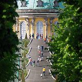 People walking up the steps to the Sanssouci Palace, Potsdam, Germany. Victoria Prymak@Unsplash