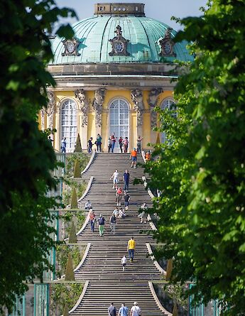 People walking up the steps to the Sanssouci Palace, Potsdam, Germany. Victoria Prymak@Unsplash