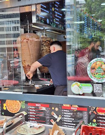 Trying a local kebab on the Berlin bike tour, Germany. CC:TO