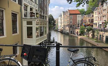 Bicycle parked on a bridge in Utrecht, Holland. Unsplash:Denise Jans