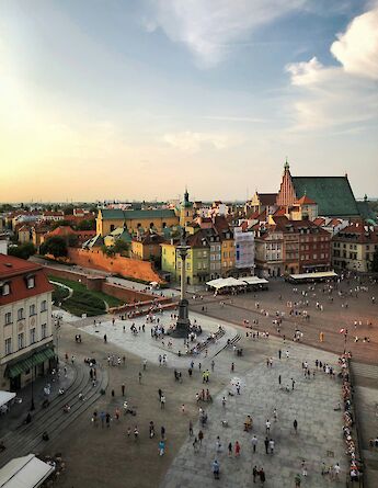 Main square of Warsaw at sunset, Poland. Victor Malyushev@Unsplash