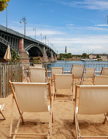 Deckchairs next to the Rhine, Mainz, Germany. Unsplash:Jurgen Kreuzer