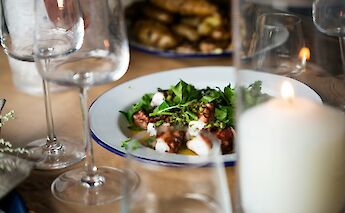 Octopus and salad dish. Unsplash:Caroline Attwood