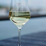 German white wine in a glass. Unsplash:Luca J