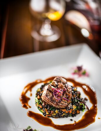 Meat and lentils with wine. Unsplash:Getty Images