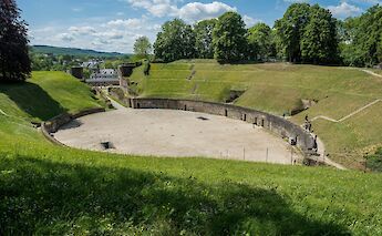Site of a Roman amphitheater, Trier, Germany. Unsplash:Alexander Schimmeck