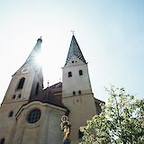 Sunlight through the church towers, Beilngries, Germany. Unsplash:Markus Spiske