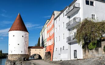 Turreted building by the river in Passau, Germany. Unsplash:Wolfgang Weiser