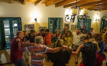 Guests dancing together, Island of Lipsi, Greece. CC:Island Hopping