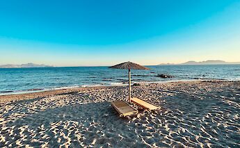 Sun loungers on the Island of Kos, Greece. Unsplash:Christian Klose