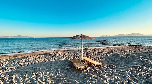 Sun loungers on the Island of Kos, Greece. Unsplash:Christian Klose