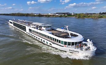 1. A river cruise boat named "Lisabelle" sailing on a wide river, with a clear sky and&hellip;