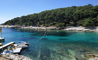 Boats in a bay, Losinj, Croatia. Unsplash:Alexandre Ours