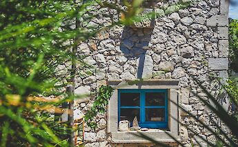 House on Lošinj, Croatia. Unsplash:Ante Hamersmit