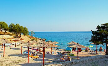 Parasols on Pag, Croatia. Unsplash:HLS 44